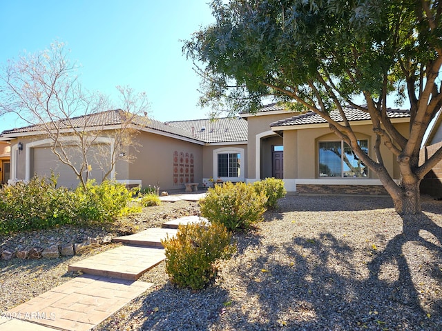 view of front of property with a garage