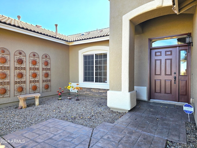 property entrance with a patio area