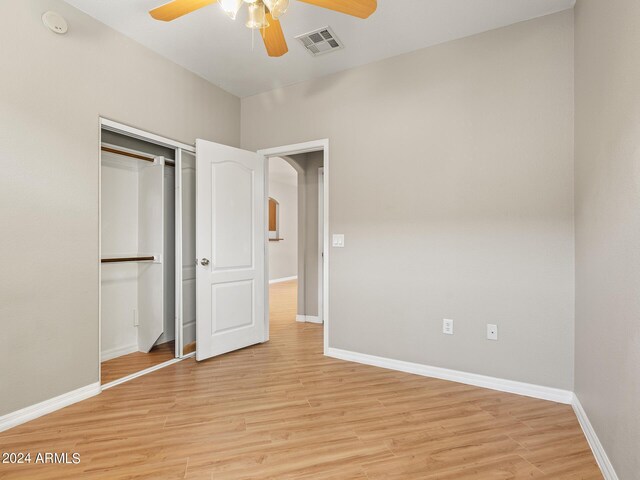 empty room featuring ceiling fan and light wood-type flooring