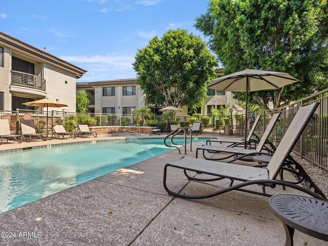 view of swimming pool featuring a patio area