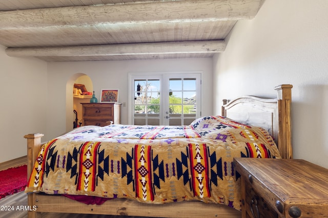 bedroom featuring french doors, wood ceiling, and beam ceiling