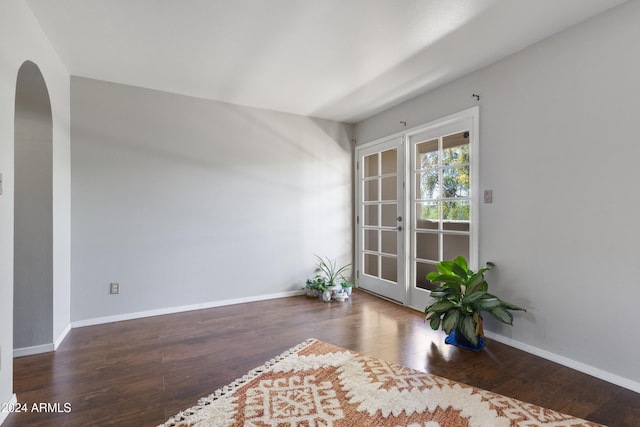 interior space with dark wood-type flooring and french doors