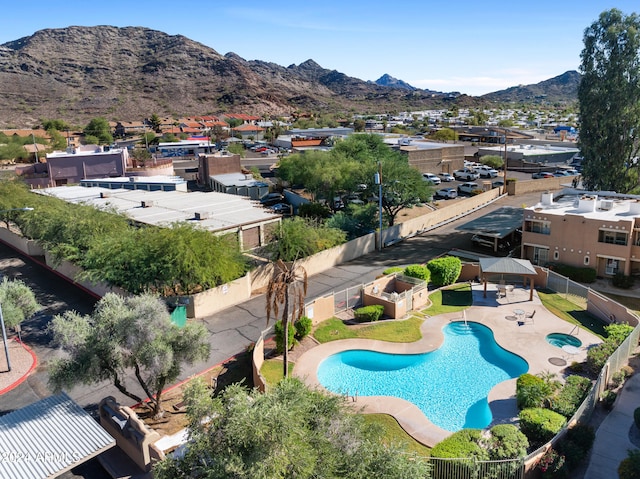 birds eye view of property with a mountain view