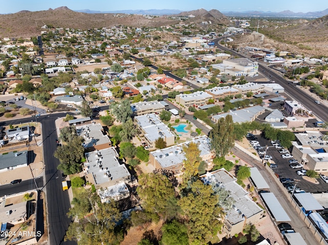 birds eye view of property featuring a mountain view