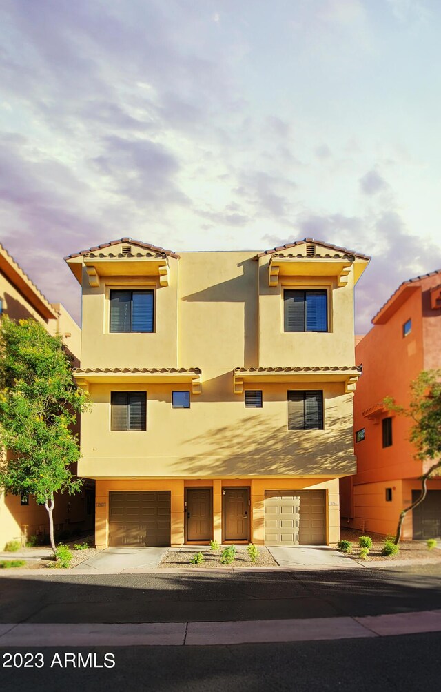 9551 E Redfield Rd Unit 1061, Scottsdale, AZ 85260 - view of front of home featuring an attached garage, stucco siding, and concrete driveway
