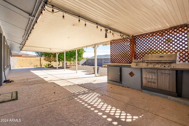 view of patio with a mountain view and area for grilling