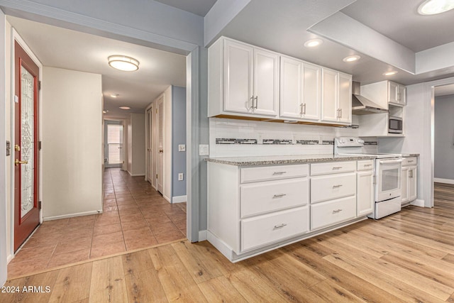 kitchen with light hardwood / wood-style floors, light stone counters, backsplash, electric range, and white cabinetry