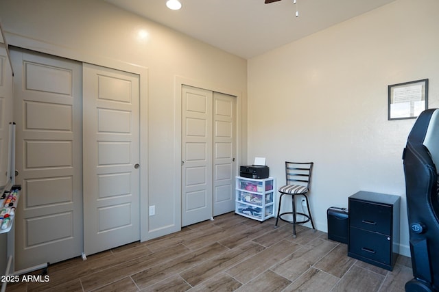 home office featuring wood tiled floor, ceiling fan, recessed lighting, and baseboards