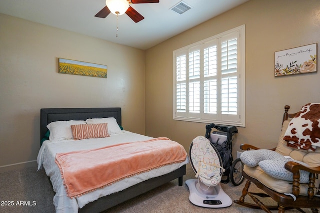 bedroom with carpet floors, baseboards, ceiling fan, and visible vents