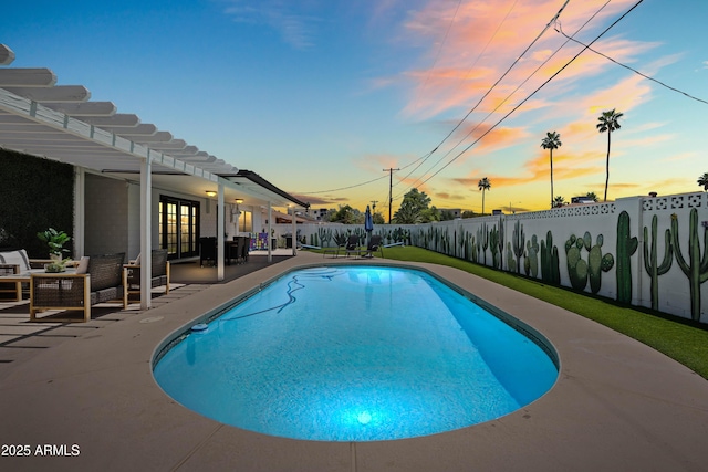 8315 E Devonshire Ave, Scottsdale, AZ 85251 - pool at dusk featuring a fenced backyard, a patio area, and french doors