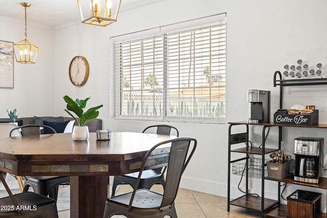 8315 E Devonshire Ave, Scottsdale, AZ 85251 - dining space featuring a chandelier, plenty of natural light, ornamental molding, baseboards, and light tile patterned flooring
