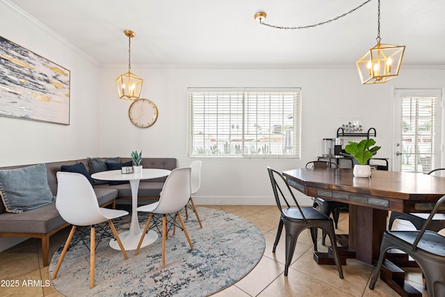 8315 E Devonshire Ave, Scottsdale, AZ 85251 - dining room with a chandelier, ornamental molding, light tile patterned floors, and baseboards