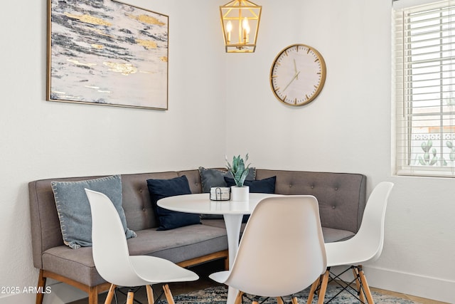 8315 E Devonshire Ave, Scottsdale, AZ 85251 - dining area with breakfast area, baseboards, and a chandelier