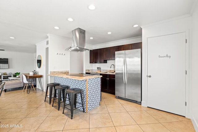 8315 E Devonshire Ave, Scottsdale, AZ 85251 - kitchen with freestanding refrigerator, island exhaust hood, a kitchen breakfast bar, a sink, and ornamental molding