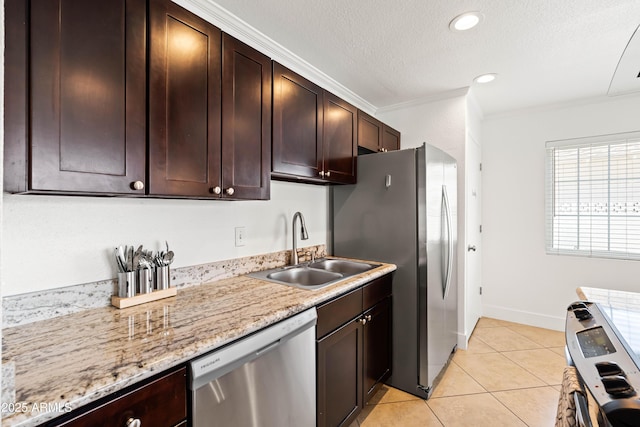 8315 E Devonshire Ave, Scottsdale, AZ 85251 - kitchen featuring appliances with stainless steel finishes, a sink, dark brown cabinetry, light tile patterned flooring, and ornamental molding