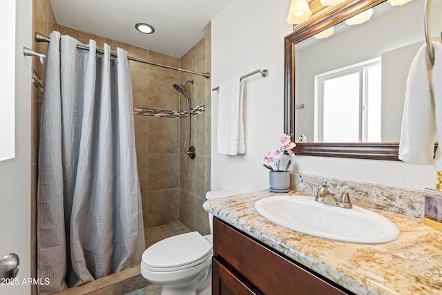 8315 E Devonshire Ave, Scottsdale, AZ 85251 - full bathroom with toilet, vanity, and a tile shower