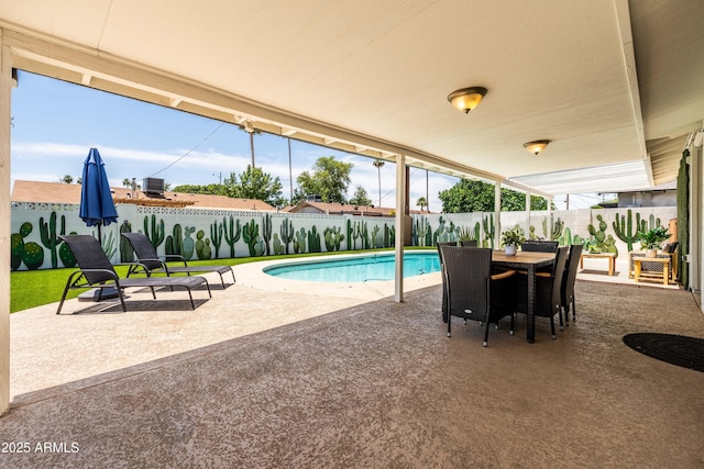 8315 E Devonshire Ave, Scottsdale, AZ 85251 - view of pool featuring a patio area, a fenced backyard, and outdoor dining space