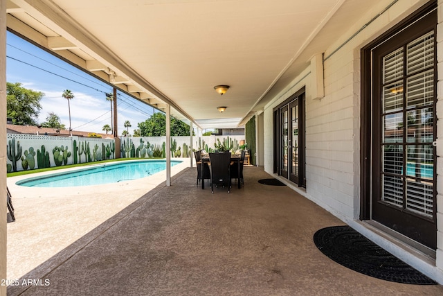 8315 E Devonshire Ave, Scottsdale, AZ 85251 - view of swimming pool with a patio, a fenced backyard, and french doors