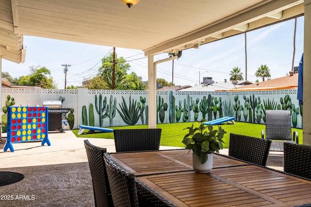 8315 E Devonshire Ave, Scottsdale, AZ 85251 - fenced backyard with a patio, area for grilling, and outdoor dining area