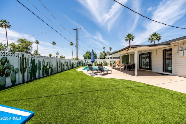 8315 E Devonshire Ave, Scottsdale, AZ 85251 - view of yard with a patio and french doors