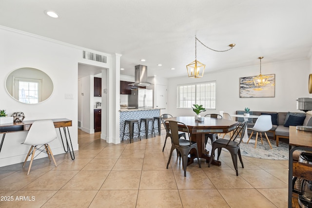 8315 E Devonshire Ave, Scottsdale, AZ 85251 - dining space featuring crown molding, light tile patterned floors, recessed lighting, and a chandelier