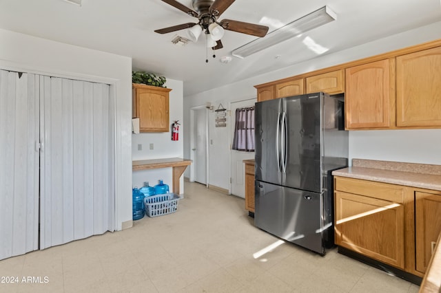 kitchen with stainless steel fridge and ceiling fan