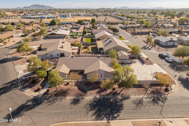 birds eye view of property with a mountain view