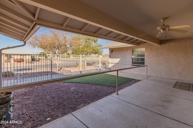 view of yard with a patio area and ceiling fan