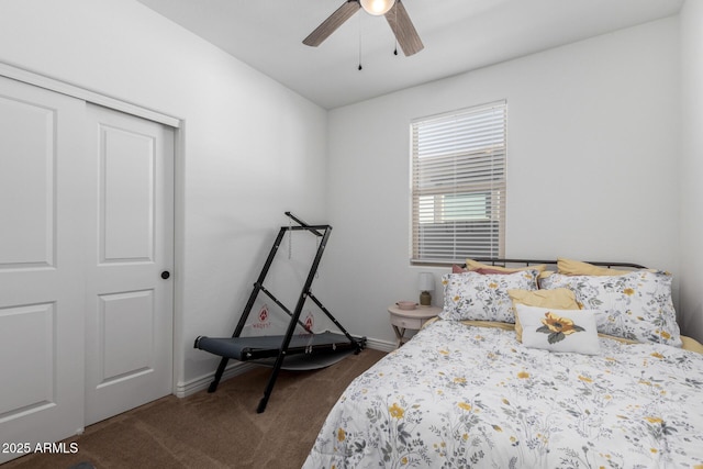 carpeted bedroom with ceiling fan and a closet