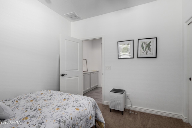 bedroom featuring dark colored carpet