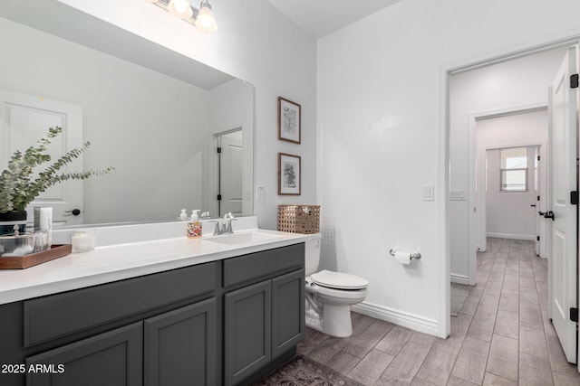 bathroom with toilet and vanity