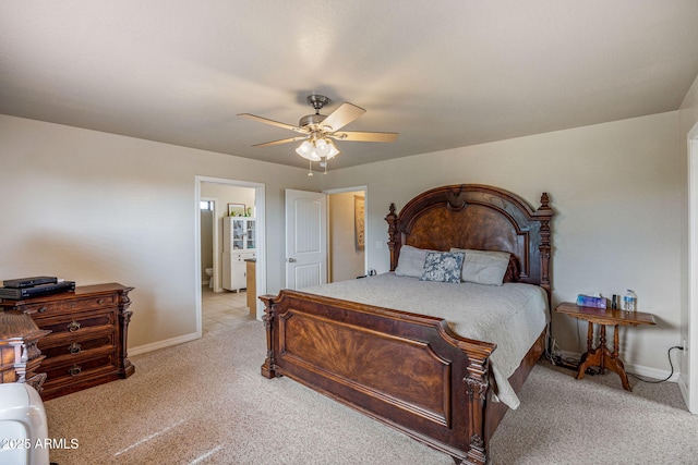 8870 Happy Trl, Show Low, AZ 85901 - bedroom with light colored carpet, ceiling fan, and connected bathroom