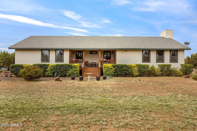 8870 Happy Trl, Show Low, AZ 85901 - ranch-style home featuring covered porch, a front lawn, a chimney, and a shingled roof