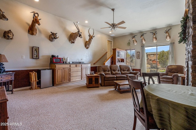 8870 Happy Trl, Show Low, AZ 85901 - living room featuring ceiling fan, recessed lighting, light colored carpet, wet bar, and stairway