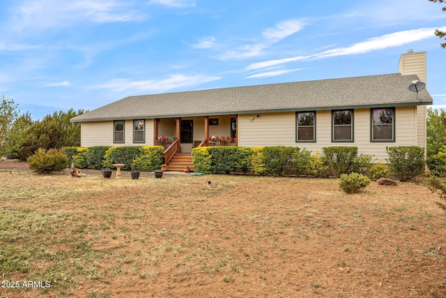 8870 Happy Trl, Show Low, AZ 85901 - single story home featuring covered porch, a front lawn, a chimney, and roof with shingles