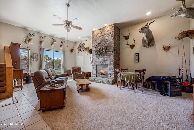 8870 Happy Trl, Show Low, AZ 85901 - carpeted living room featuring a ceiling fan, a fireplace, recessed lighting, and tile patterned floors