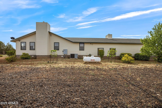 8870 Happy Trl, Show Low, AZ 85901 - back of house with a chimney