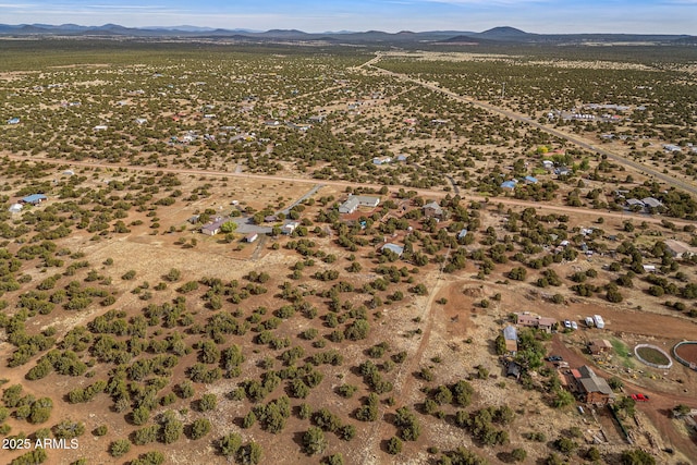 8870 Happy Trl, Show Low, AZ 85901 - aerial view of property and surrounding area with a mountain backdrop and rural landscape