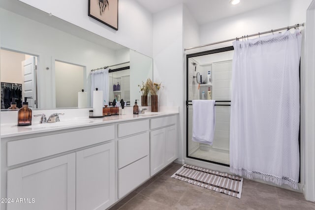 bathroom with tile patterned flooring, vanity, and a shower with curtain