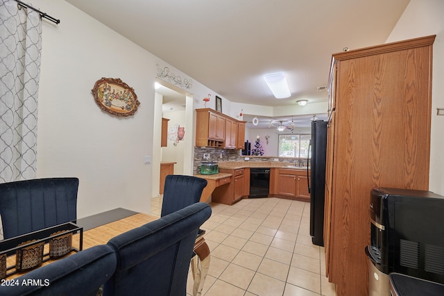 kitchen featuring backsplash, ceiling fan, light tile patterned floors, and black appliances