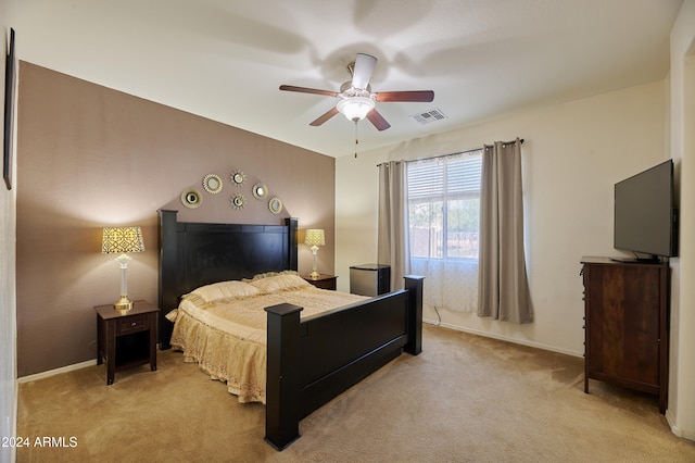 bedroom featuring ceiling fan and light colored carpet