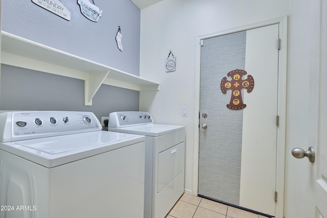 washroom featuring light tile patterned floors and independent washer and dryer