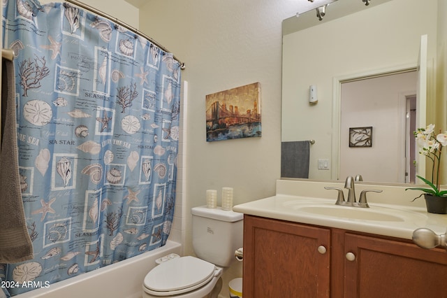 full bathroom with shower / bath combo with shower curtain, vanity, and toilet