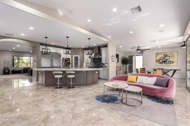 14749 E Pecos Rd, Gilbert, AZ 85295 - living room with visible vents, marble finish floor, ceiling fan, recessed lighting, and arched walkways