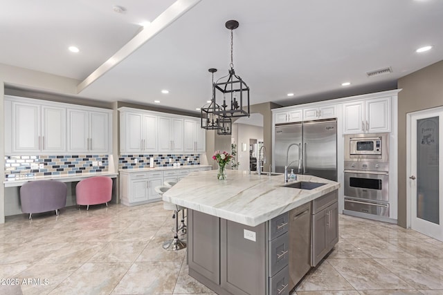 14749 E Pecos Rd, Gilbert, AZ 85295 - kitchen featuring built in appliances, white cabinetry, tasteful backsplash, visible vents, and a warming drawer