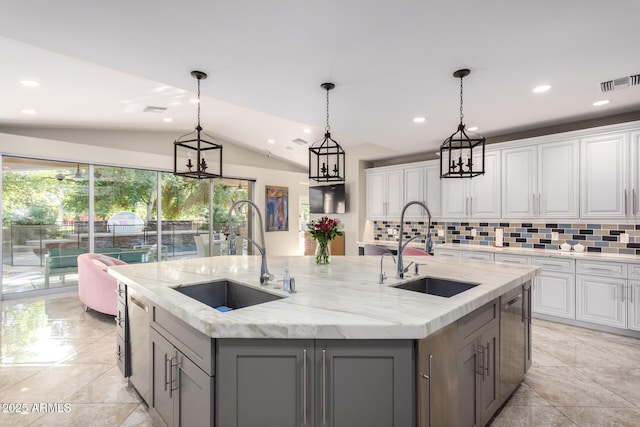 14749 E Pecos Rd, Gilbert, AZ 85295 - kitchen featuring gray cabinetry, visible vents, a center island with sink, and a sink