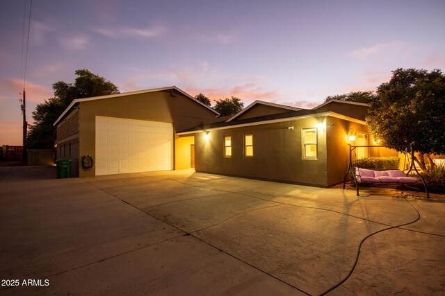 14749 E Pecos Rd, Gilbert, AZ 85295 - view of front facade with a garage, stucco siding, and driveway