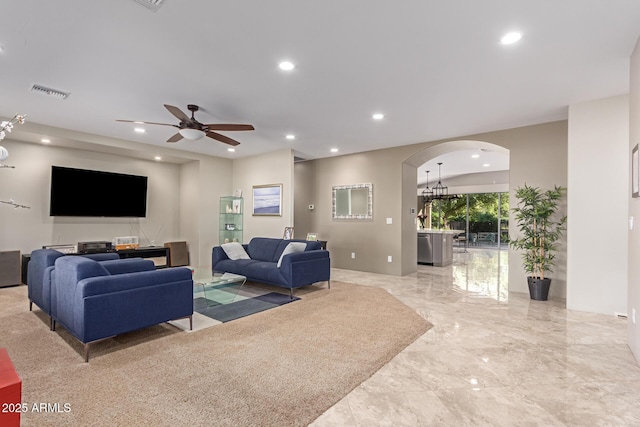 14749 E Pecos Rd, Gilbert, AZ 85295 - living area featuring visible vents, marble finish floor, ceiling fan, recessed lighting, and arched walkways