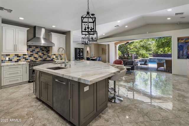 14749 E Pecos Rd, Gilbert, AZ 85295 - kitchen featuring open floor plan, wall chimney exhaust hood, a sink, vaulted ceiling, and stainless steel appliances