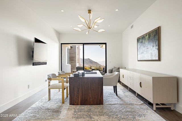 office with an inviting chandelier and dark hardwood / wood-style floors